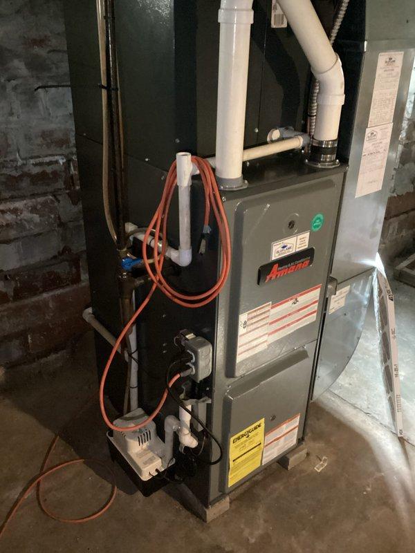 Completed comprehensive replacement estimate for 15-year-old Amana furnace and air conditioning system. Evaluated existing indoor heating unit located in basement utility area and outdoor condensing unit positioned on exterior concrete pad. Based on equipment age and maintenance requirements, recommended full system replacement to ensure continued reliable heating and cooling performance.