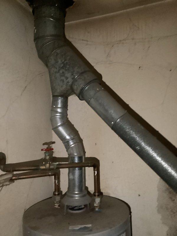 Conducted comprehensive site assessment of existing boiler system in basement mechanical room to provide replacement estimate. Evaluated current hydronic heating system including boiler unit, expansion tanks, copper piping distribution network, and associated safety valves and controls. Documented existing equipment configuration, including Well-X-Trol expansion tank, supply and return piping arrangements, and ductwork connections. Photographed installation to capture current system layout, component conditions, and spatial constraints for accurate replacement planning and equipment sizing recommendations.