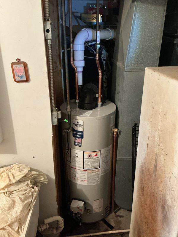Installed 40-gallon power vent water heater with 3" flue system, including proper venting components with 3" coupling and 3x2 reducer. Completed all copper piping connections, mounted expansion tank, verified level installation, and ensured all plumbing infrastructure meets code requirements for safe operation.