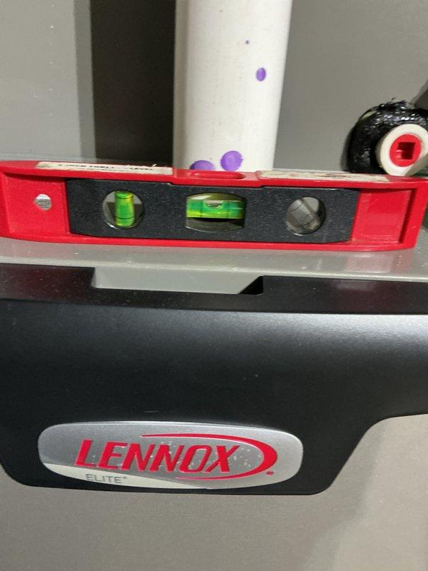 Completed scheduled maintenance on 5-year-old Lennox Elite gas furnace. Performed comprehensive system inspection including control board diagnostics, verified proper electrical connections and wire bundle integrity, checked system level for proper installation alignment, and tested all safety controls and components. All wiring secured with proper cable management, LED indicators functioning normally, and unit operating within manufacturer specifications upon completion.