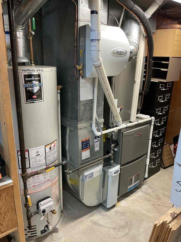 Completed routine furnace maintenance on a 4-year-old Lennox heating system located in the basement. Performed standard inspection procedures including checking all operational components, verifying proper airflow, inspecting the humidifier installation, examining condensate drainage lines, and ensuring all safety controls were functioning correctly. All equipment found to be operating within normal parameters with no repairs required at this time.