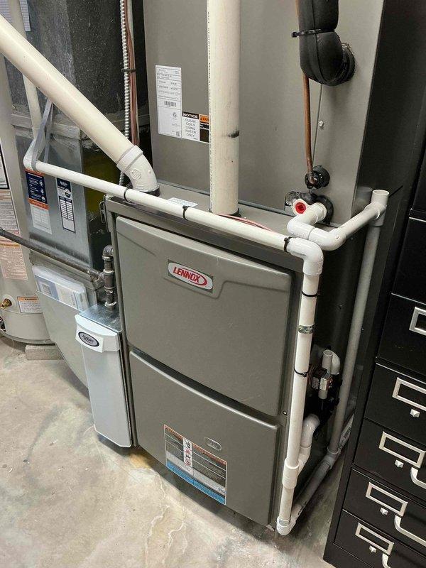 Completed routine furnace maintenance on a 4-year-old Lennox heating system located in the basement. Performed standard inspection procedures including checking all operational components, verifying proper airflow, inspecting the humidifier installation, examining condensate drainage lines, and ensuring all safety controls were functioning correctly. All equipment found to be operating within normal parameters with no repairs required at this time.
