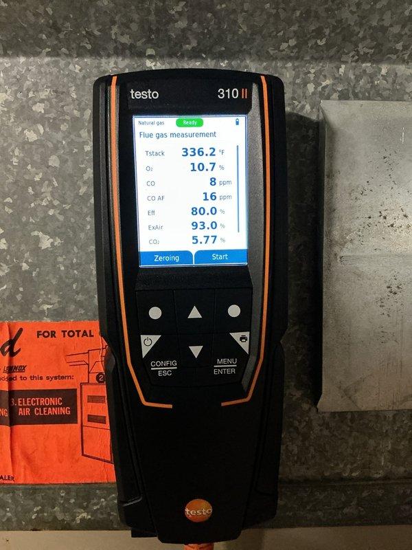 Completed comprehensive furnace tune-up on 6-year-old Amana gas-powered heating system. Performed combustion analysis using Testo 310 II flue gas analyzer, recording stack temperature of 336.2°F, oxygen level at 10.7%, carbon monoxide at 8 ppm (16 ppm air-free), and efficiency at 80.0% with CO2 at 5.77%. All combustion readings fell within acceptable parameters for safe operation. Inspected all system components, verified proper gas line connections, and confirmed furnace operational status for the heating season.