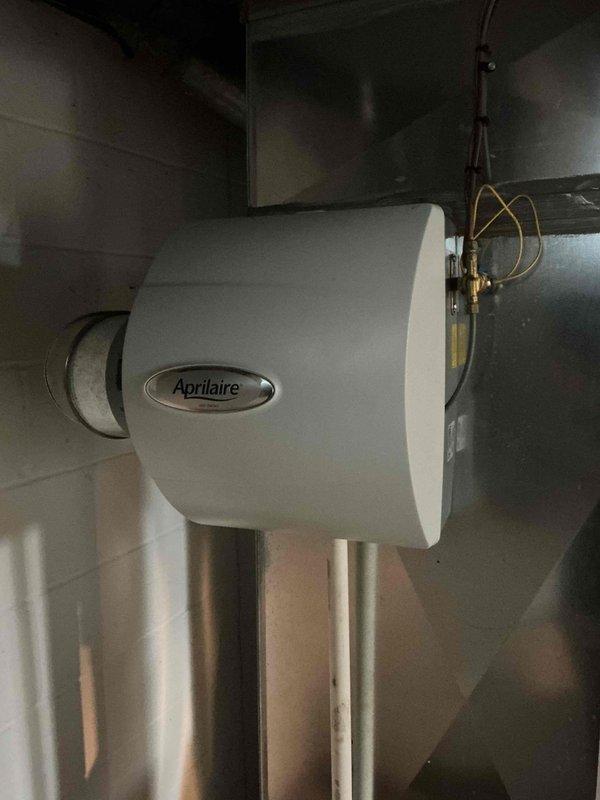 Completed comprehensive heating maintenance on 14-year-old gas furnace system, including inspection of all major components, burner assembly, heat exchanger, and venting system. Serviced Aprilaire whole-home humidifier mounted to ductwork, verified water supply connections and operation. All equipment found operating within normal parameters with no immediate safety concerns identified.