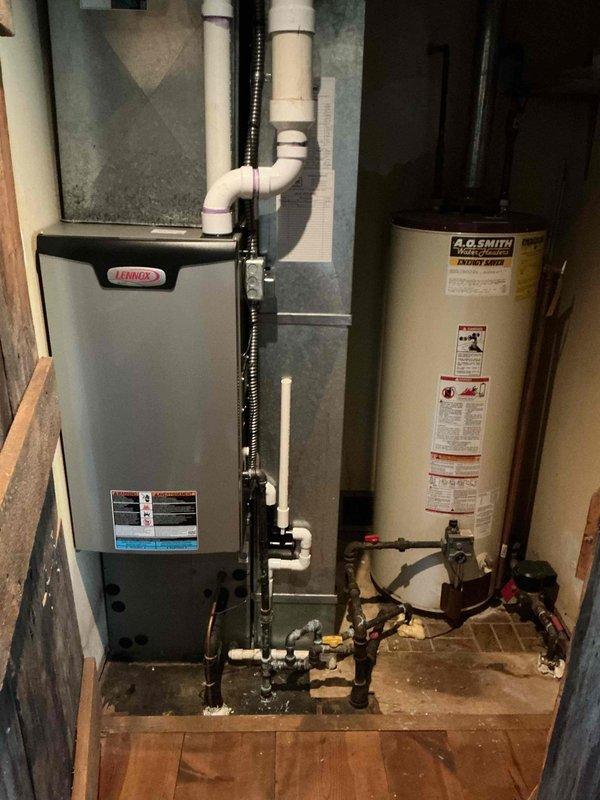 Completed comprehensive tune-up service on residential HVAC system including 3-year-old Lennox gas furnace and 13-year-old outdoor air conditioning unit. Performed full system inspection, filter replacement, cleaned condenser coils, verified refrigerant levels, tested electrical connections, and confirmed proper operation of both heating and cooling systems. All equipment operating within manufacturer specifications with no issues found.