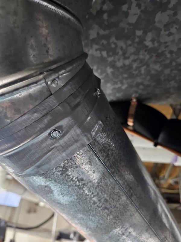 Completed install callback to address code compliance issues. Installed required metal strap on exhaust and combustion air pipes per manufacturer specifications and mechanical code requirements, and inspected and tightened mounting screws in humidifier bypass damper to ensure proper operation.