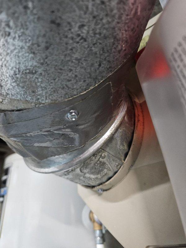 Completed install callback to address code compliance issues. Installed required metal strap on exhaust and combustion air pipes per manufacturer specifications and mechanical code requirements, and inspected and tightened mounting screws in humidifier bypass damper to ensure proper operation.