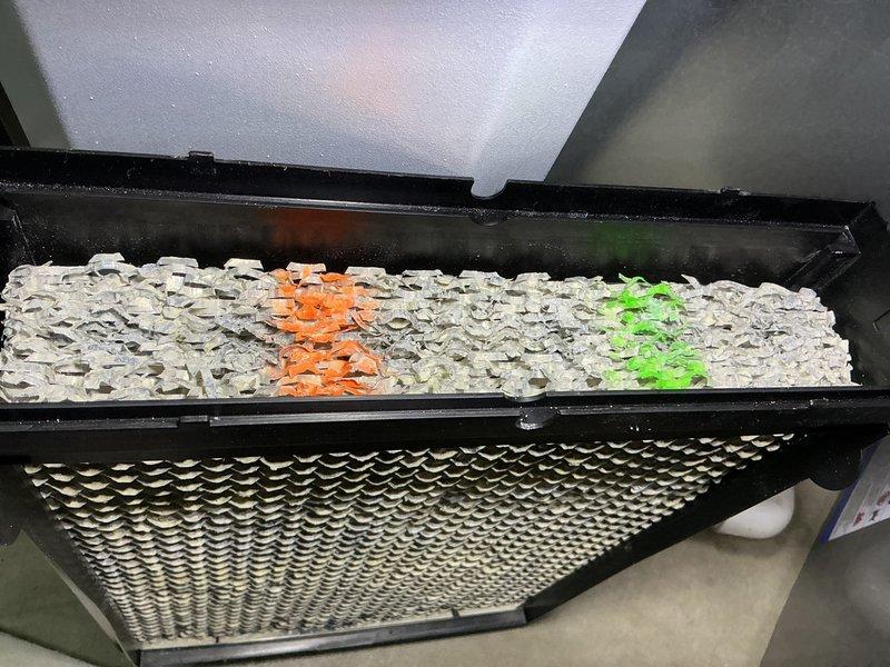 Completed routine maintenance tune-up on a 2-year-old furnace system. Inspected and serviced the air filtration unit, which included examining the honeycomb mesh filter media and internal filtration components housed in the black metal frame assembly. All system components were found to be operating within normal parameters for a unit of this age.