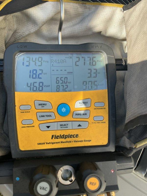 Responded to service call for 2-year-old A/C unit with reported oil leak at outdoor condenser. Upon inspection, identified refrigerant line connections at outdoor unit showing signs of potential oil migration. Connected Fieldpiece SMAN digital manifold gauges to system and performed complete refrigerant pressure diagnostics. Recorded system pressures with low side reading 134.8 PSI and high side reading 277.6 PSI. Inspected all copper refrigerant lines, joints, and fittings at condenser unit for leak source. Verified system operating parameters and determined oil residue was minimal with no active refrigerant leak detected at time of service. System pressures within acceptable range for current operating conditions. Advised monitoring for any future occurrences.