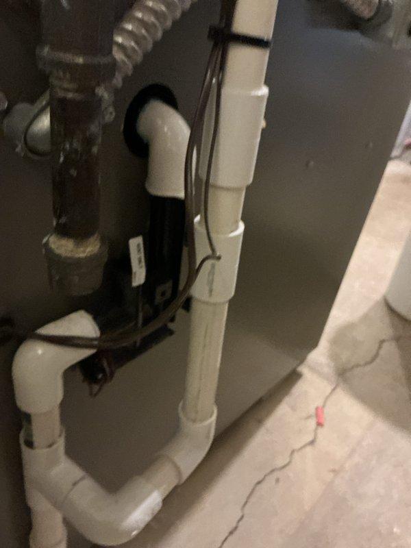 Performed seasonal heating maintenance on a 3-year-old gas furnace, including inspection of the condensate drain piping, secondary connections, and cabinet wiring, and replaced the dirty 16x25x1 pleated return air filter. Noted a visible crack in the concrete floor near the unit and a gap at a PVC coupling on the condensate line, which should be monitored for leaks.