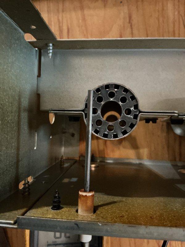 Performed annual maintenance on a 7-year-old gas furnace, including inspection of the burner assembly and flame sensor, where light corrosion and residue were noted on the sensor fitting and enclosure base. Verified draft/pressure switch operation and system pressure readings using a dual-port digital manometer, with both ports reading approximately 7.5 inWC, and checked control board wiring and connections for proper condition.