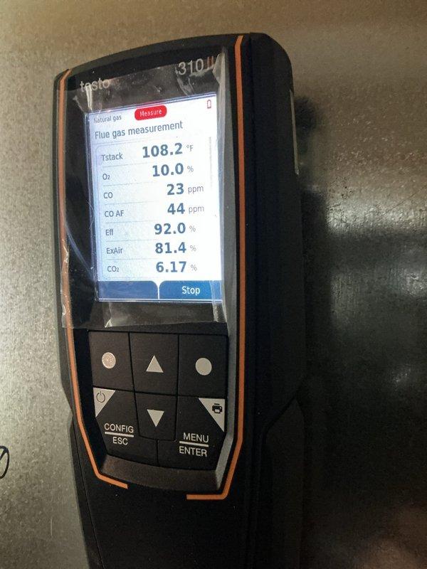Performed annual heating maintenance on the gas furnace, including a combustion analysis with a Testo 310 II that showed normal results (stack temp 108.2°F, O₂ 10.0%, CO 23 ppm, CO₂ 6.17%, efficiency 92.0%). Inspection of the furnace cabinet also revealed significant rust and corrosion on the internal shelf panel beneath the gas valve and piping, which should be monitored and addressed to prevent further deterioration.