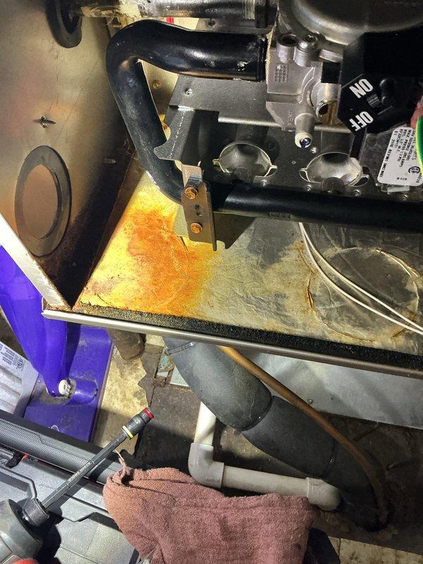 Performed annual heating maintenance on the gas furnace, including a combustion analysis with a Testo 310 II that showed normal results (stack temp 108.2°F, O₂ 10.0%, CO 23 ppm, CO₂ 6.17%, efficiency 92.0%). Inspection of the furnace cabinet also revealed significant rust and corrosion on the internal shelf panel beneath the gas valve and piping, which should be monitored and addressed to prevent further deterioration.