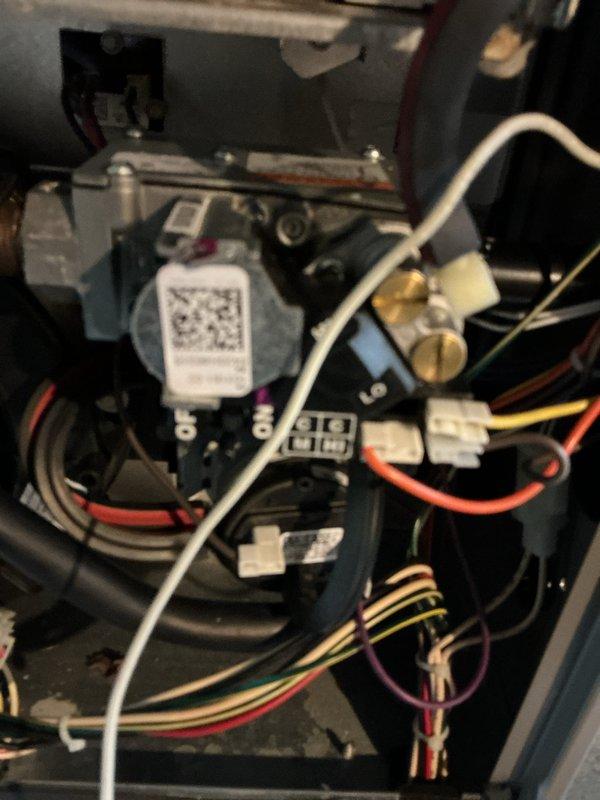 Performed a complete heating tune-up on the basement furnace, including inspection of the gas valve assembly, control wiring, and connections. Verified manifold gas pressure using a dual-port digital manometer, with readings within normal operating range. The system was found operating properly with no deficiencies noted.