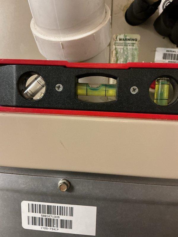Performed a seasonal tune-up on a 5-year-old gas furnace, verifying the unit was level and inspecting the condensate PVC drain line and fittings. Inspected the gas valve assembly and low-voltage/line-voltage wiring connections, noting minor surface corrosion beneath the gas valve. Confirmed secure wire routing and documented equipment data plate information for service records.
