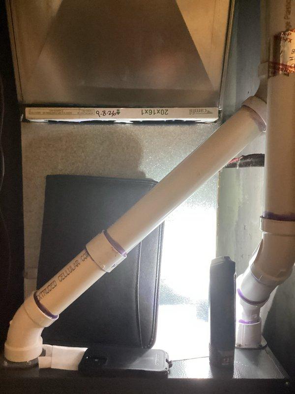 Performed an on-site replacement estimate for an existing downflow Goodman gas furnace installed in a closet, with a possible add-on or replacement of the air conditioning system. Inspected the cabinet, PVC condensate drain assembly with trap, flexible electrical conduit, and return-air filter section, noting debris in the condensate drain area and documenting existing conditions with photographs to determine equipment sizing and replacement scope.