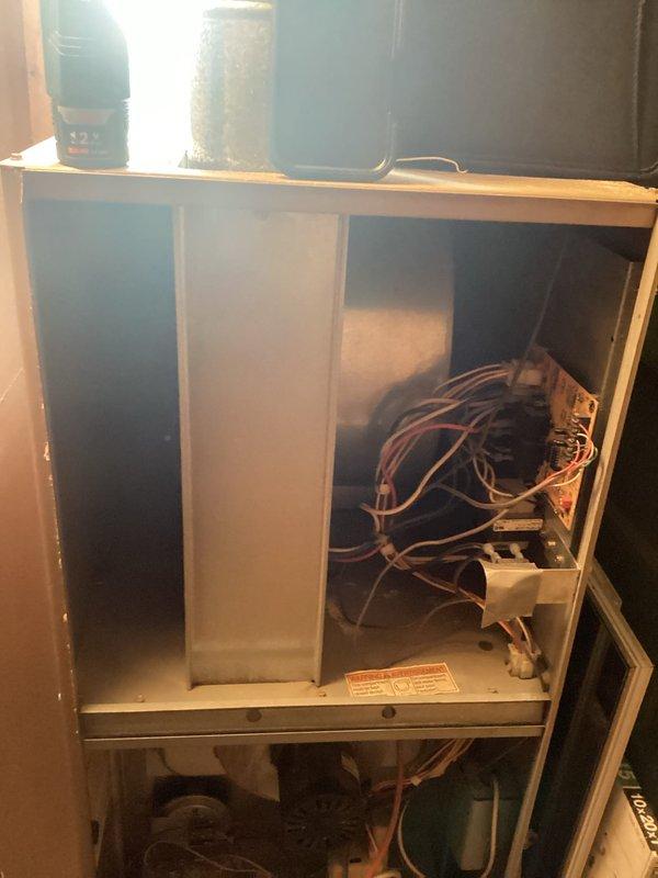 Performed an on-site evaluation of the existing gas furnace and air handler for full system replacement, inspecting the control board, wiring harness, blower assembly, burner section, igniter, pressure switch, and condensate drain components. Documented heavy dust and debris accumulation, loose insulation near the motor, taped wiring repairs, and a 10x20x1 return filter, with photos taken to support the replacement recommendation for both the furnace and AC.