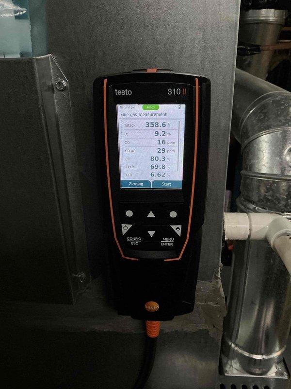 Performed a seasonal tune-up on a 6-year-old Amana natural gas furnace, inspecting the flue, condensate drain, refrigerant line, and plenum connections for leaks, corrosion, and proper support. Conducted a combustion analysis with a Testo 310 II, recording a stack temperature of 358.6°F, 9.2% O₂, 6.62% CO₂, 16 ppm CO (29 ppm air-free), and 80.3% efficiency, with all readings within acceptable limits for safe operation. System is operating normally with no visible frost, ice, or rust.