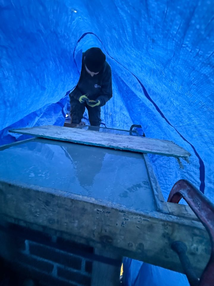 Removed 50 courses of brick and installed a crown