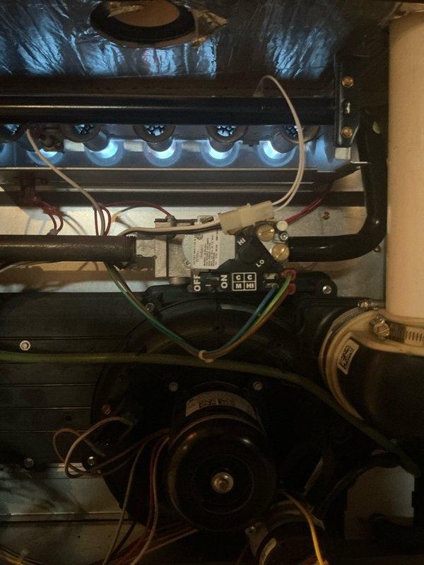 Performed annual maintenance on 8-year-old MVP gas furnace. Inspected blower wheel assembly for proper operation and cleaned components. Verified flame sensor and burner assembly functioning correctly with good blue flame pattern. System operating within normal parameters.