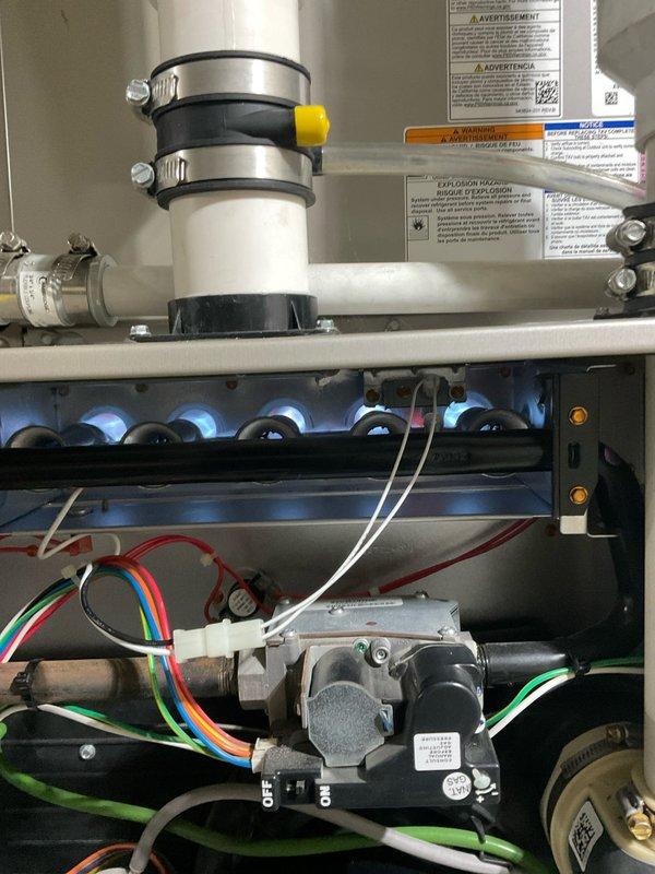 Performed dual furnace tuneup and humidifier preventive maintenance service under renewed home service plan. Inspected furnace components including gas valve assembly, burner tubes, and venting system with all connections secure and operational. Verified proper wiring connections at control module with no signs of damage or abnormal wear.