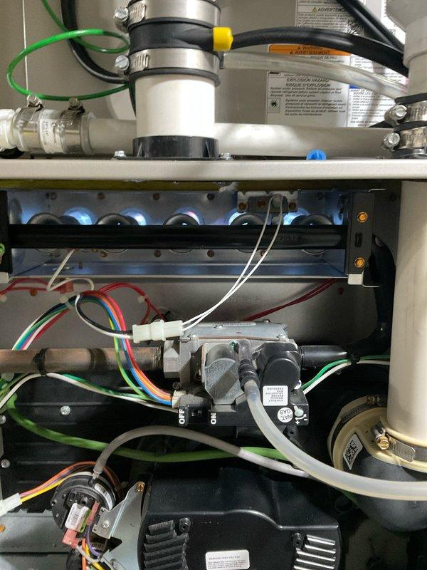 Performed dual furnace tuneup and humidifier preventive maintenance service under renewed home service plan. Inspected furnace components including gas valve assembly, burner tubes, and venting system with all connections secure and operational. Verified proper wiring connections at control module with no signs of damage or abnormal wear.
