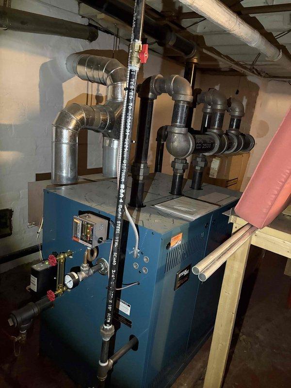 Conducted site assessment for installation of high velocity HVAC system. Examined existing blue boiler system with associated piping, valves, pressure gauges, and control mechanisms. Documented current setup including ductwork configuration and connection points to determine optimal integration strategy for the proposed high velocity system.