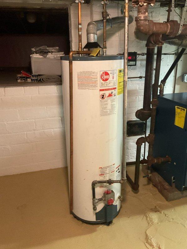 Installed new Rheem tanked water heater per existing quote #10:29. Unit features ICON System control panel with temperature regulation and safety features. Completed all necessary copper and galvanized pipe connections. Verified proper functioning of control panel and confirmed no leaks in the basement mechanical room installation.
