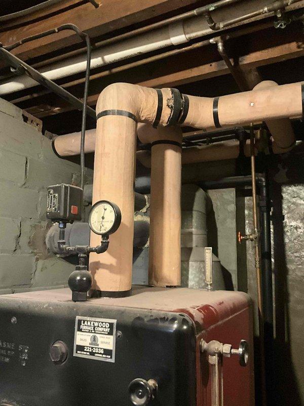 Conducted comprehensive inspection of existing Lakewood Furnace Company boiler system in basement utility area. Documented current installation including primary boiler unit, pressure gauge configuration, and associated PVC plumbing network with multiple 90-degree joints. Prepared detailed replacement quote for customer review, with scheduling options confirmed for upcoming boiler maintenance service.