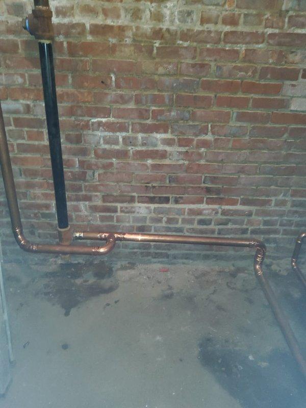 Completed replacement of 4 sections on the left side of steam gas boiler where leakage was occurring between first and second sections. Installed new 2" copper wet return piping and Hartford loop to address multiple leaks, and repaired leaking right side supply pipe with proper pitch adjustment.