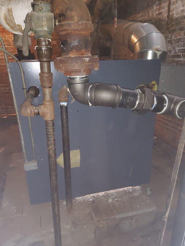 Completed replacement of 4 sections on the left side of steam gas boiler where leakage was occurring between first and second sections. Installed new 2" copper wet return piping and Hartford loop to address multiple leaks, and repaired leaking right side supply pipe with proper pitch adjustment.