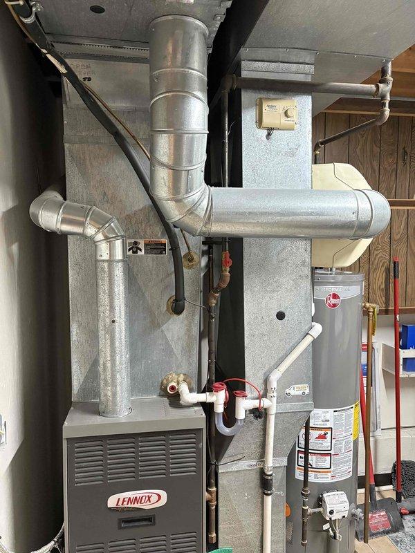 Conducted comprehensive inspection of existing HVAC system including Lennox furnace unit and associated ductwork in utility room. Took detailed measurements of equipment components and evaluated current installation configuration. Provided customer with replacement options for furnace and potentially air conditioning system as requested.