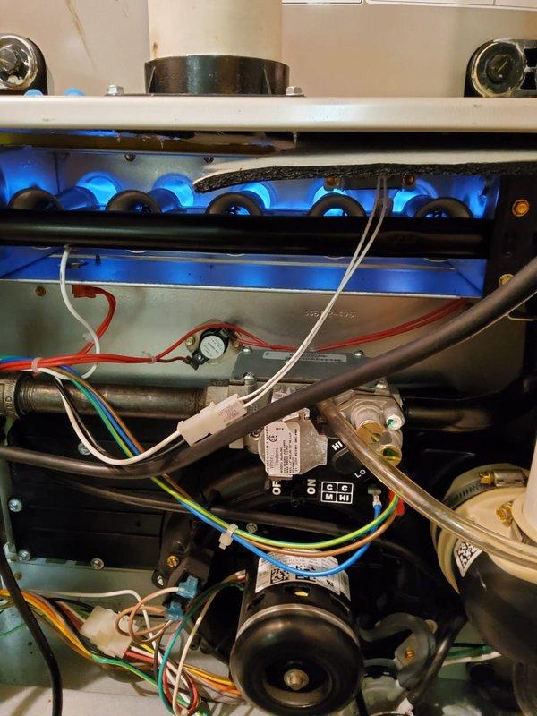 Performed comprehensive heating maintenance on two furnace systems. Inspected burner assemblies on both units, confirming proper combustion with clean blue flame patterns. Checked all electrical connections, control boards, and gas valves for proper operation, with all components functioning normally.