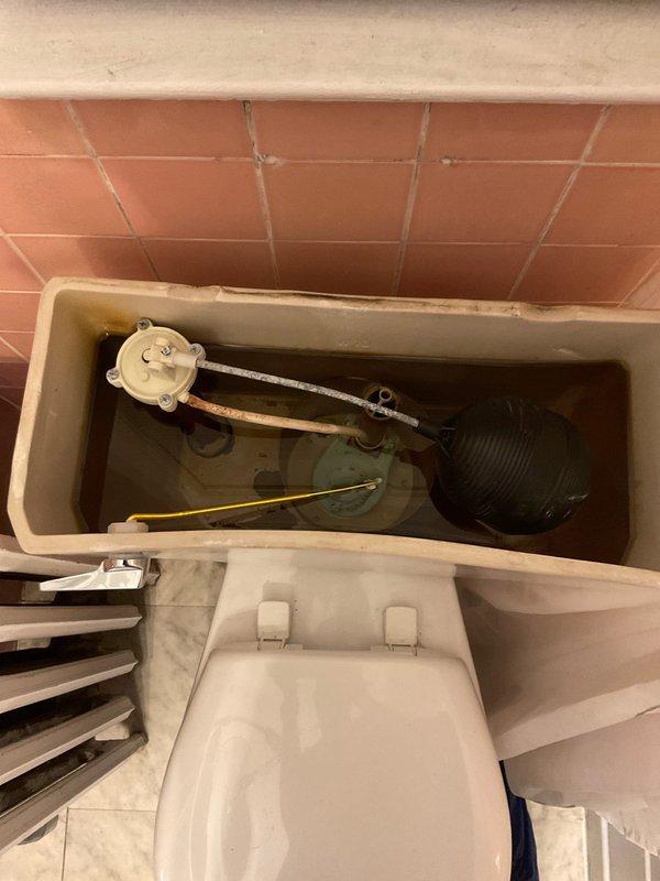 Responded to service call for toilet tank malfunction. Upon inspection, found internal tank components showing significant wear and mineral buildup. Replaced damaged flush valve mechanism to restore proper toilet function.