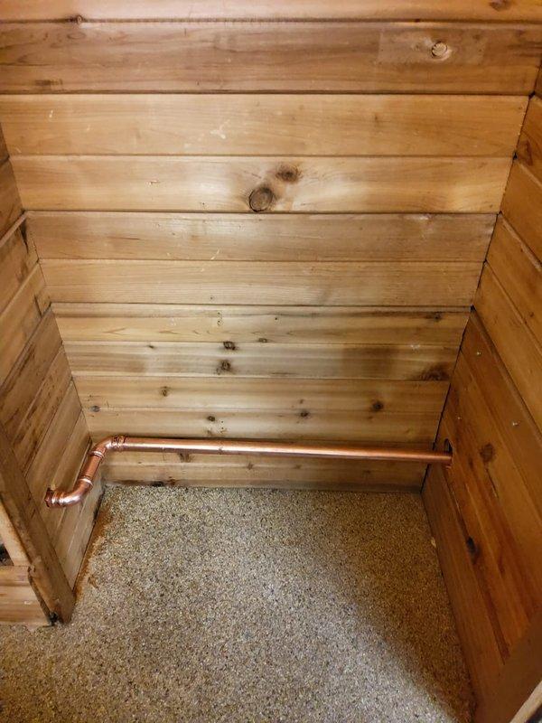 Successfully replaced deteriorated wet return piping for recently installed boiler system. Accessed pipes by opening section of old sauna wall, revealing significant moisture damage to surrounding materials. Installed new copper return lines with proper elbow joints to ensure optimal boiler operation.