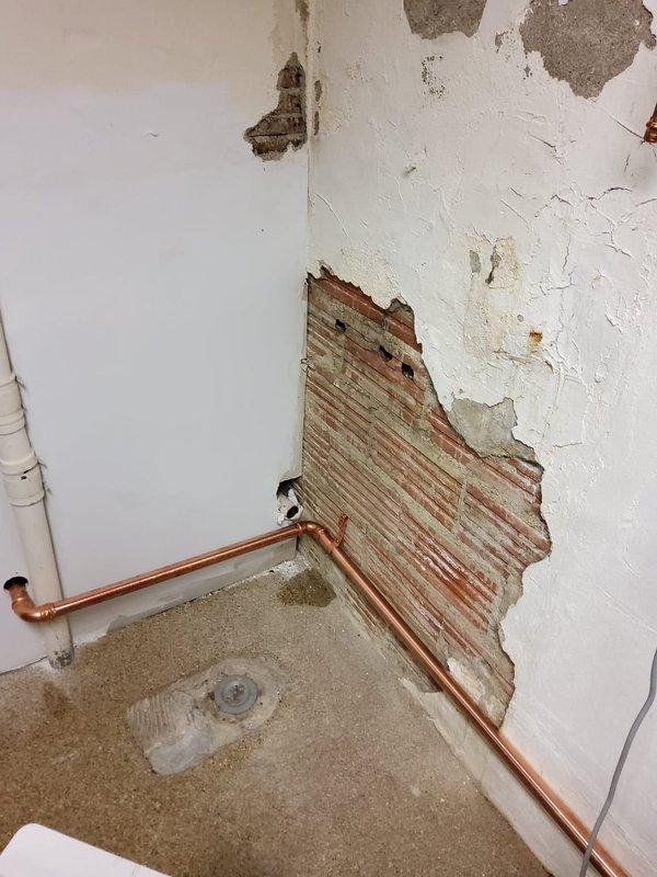 Successfully replaced deteriorated wet return piping for recently installed boiler system. Accessed pipes by opening section of old sauna wall, revealing significant moisture damage to surrounding materials. Installed new copper return lines with proper elbow joints to ensure optimal boiler operation.
