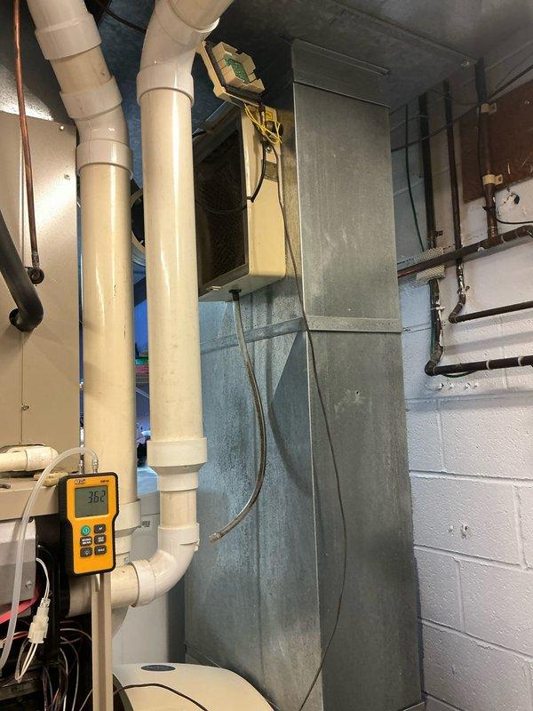 Performed scheduled maintenance on furnace system. Inspected blower wheel assembly and verified proper operation. Readings on condensate drainage system showed normal values at 36 degrees.