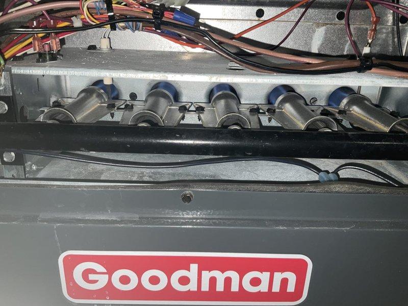 Performed maintenance service on 10+ year old Goodman furnace. Conducted combustion analysis with C161 analyzer, confirming proper operation with temperatures reaching 310.9°F. Inspected heat exchanger and verified all electrical connections were secure and properly bundled.