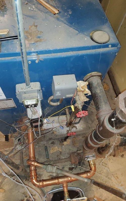 Responded to no heat call for 15-year-old furnace system. Diagnostic inspection revealed significant dust buildup on inducer motor components and signs of corrosion on heat exchanger. Performed comprehensive cleaning of inducer assembly to restore proper airflow and functionality. System now operating within normal parameters with restored heat output.