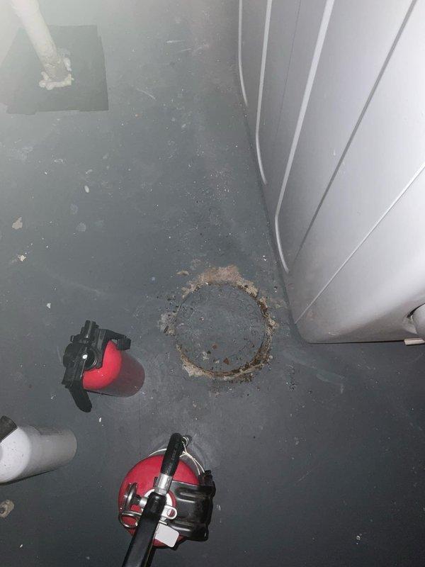 Responded to service call regarding sewer gas odor emanating from basement floor drain. Upon inspection, removed drain cover to reveal significant corrosion and deterioration around the drain opening. Cleaned drain pipe and surrounding area to eliminate the source of the offensive smell.