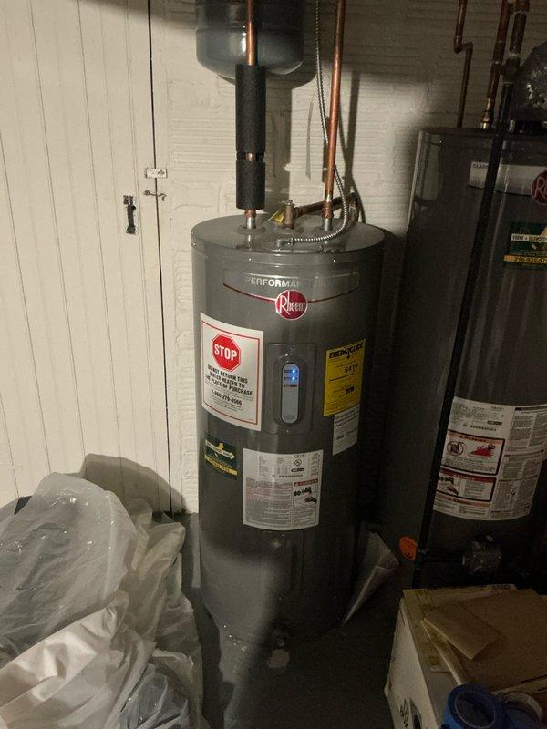 Performed scheduled preventive maintenance on boiler and furnace systems. Inspected blower wheel assembly for dust accumulation and proper operation. Documented water heater installation details including Rheem Performance unit with appropriate copper pipe connections and insulation.