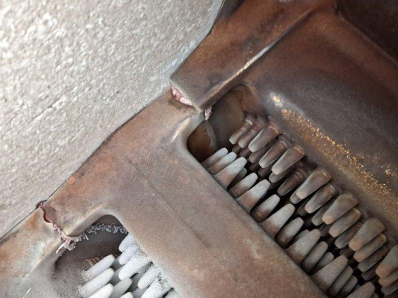 Performed scheduled Home Plan Heating Tune-Up and identified significant frost accumulation on evaporator coil along with advanced corrosion on heat exchanger components. System showing signs of restricted airflow and possible refrigerant flow issues evidenced by heavy ice formation on upper fins and brownish discoloration on lower sections.