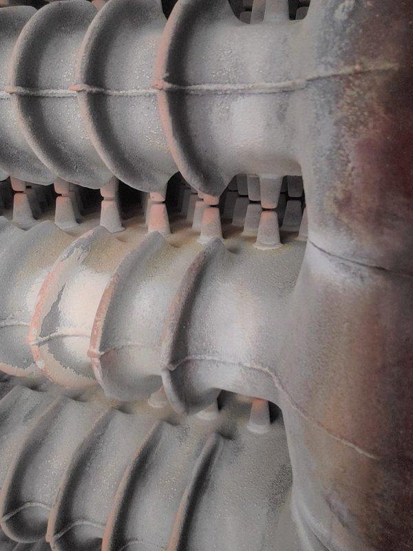 Performed scheduled maintenance on customer's boiler system per renewal plan. Inspected cast iron heat exchanger components for corrosion and wear, noting minor surface oxidation along seams. Examined electrical connections and ceramic insulators, confirming proper condition with no signs of damage or deterioration.