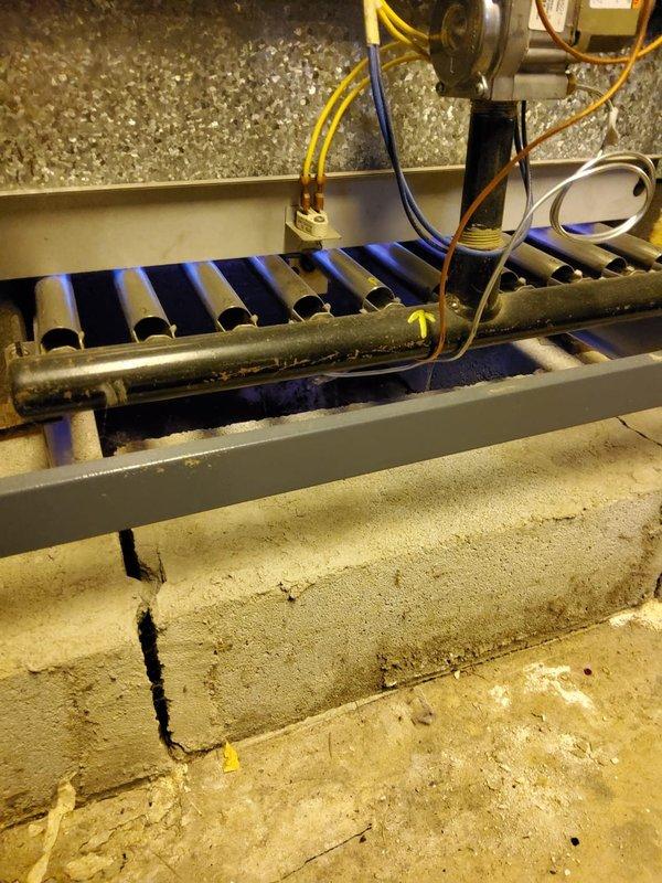 Responded to no-heat call for 10-year-old furnace displaying red flashing light instead of green. Upon inspection, found flame sensor malfunction causing improper ignition sequence. Cleaned burner assembly and heat exchanger, restored proper flame detection, and verified normal operation with stable blue flame pattern. Unit now functioning correctly with green status light.