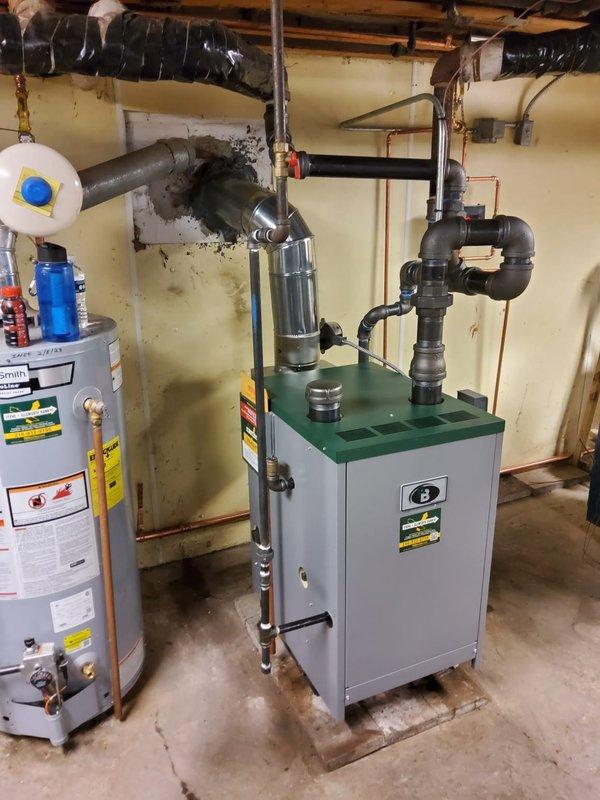Completed installation of new steam gas boiler system with backflow preventer, automatic feeder, and digital thermostat. Replaced all 15 radiator vents and 2 main line steam vents to improve system efficiency. Upgraded wet return piping to copper while maintaining existing 2" black pipe infrastructure.