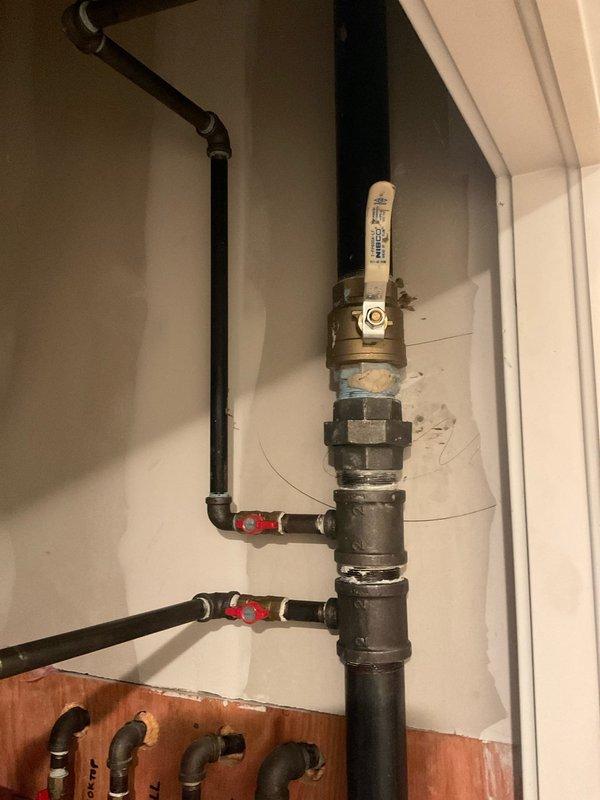 Responded to service call regarding gas leak. Upon inspection, identified a loose connection at the brass valve on the main gas line where it connects to the distribution manifold. Tightened the connection, applied appropriate pipe sealant, and pressure tested the entire system including connections to the grill, dryer and deck outlets. All valves and fittings now secure with no detectable leaks.