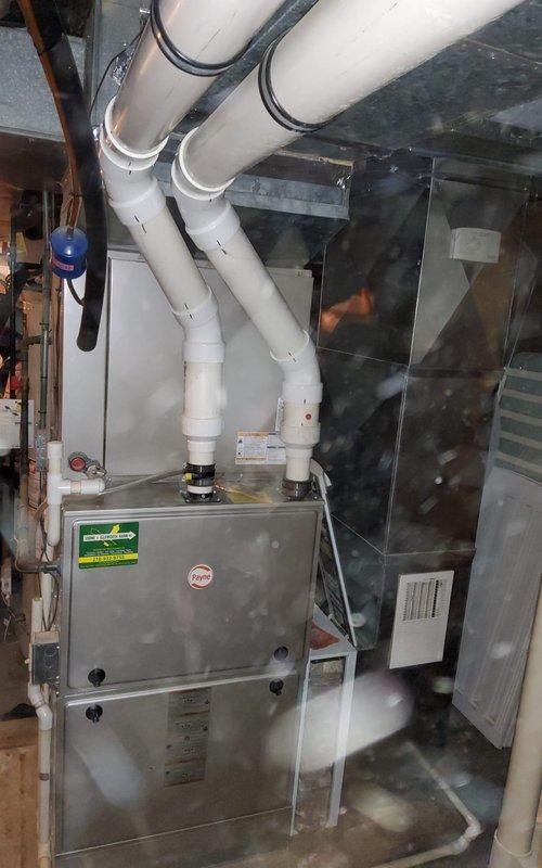Performed preventative maintenance on 10-year-old MVP gas furnace. Inspected burner assembly confirming proper flame pattern with consistent blue flames. Conducted diagnostic testing with multimeter to verify electrical components functioning within specifications. Visual inspection of exhaust/intake PVC ventilation system showed proper installation with no apparent issues.