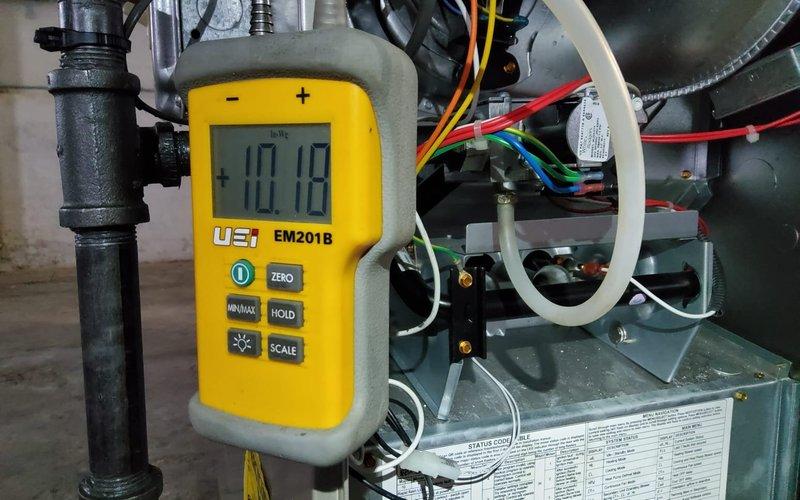 Diagnosed recurring no heat issue after multiple previous service calls. Performed voltage testing with UEi EM201B meter showing 10.12V at control board. Confirmed proper ignition sequence and burner operation with strong blue flames across heat exchanger. System is now functioning correctly with all safety parameters within normal range.