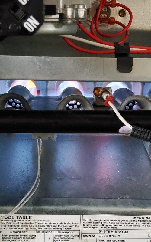 Diagnosed recurring no heat issue after multiple previous service calls. Performed voltage testing with UEi EM201B meter showing 10.12V at control board. Confirmed proper ignition sequence and burner operation with strong blue flames across heat exchanger. System is now functioning correctly with all safety parameters within normal range.