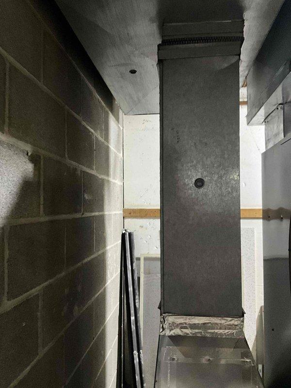 Conducted comprehensive inspection of existing HVAC system in utility room for potential humidifier installation. Evaluated current ductwork configuration, including spiral-wound flexible conduits and sheet metal components connected to the main furnace unit. Assessed available mounting locations and water supply access points for optimal humidifier placement.